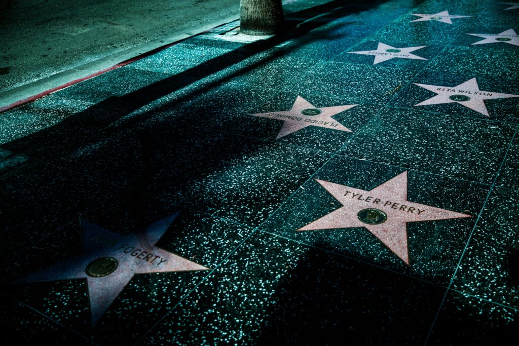 pexels-photo-4700359-4700359 Night view of Hollywood Walk of Fame stars showcasing celebrity names and iconic design.